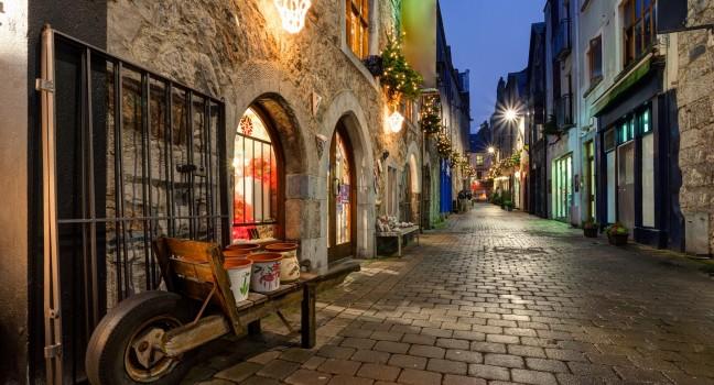Old street in Galway, Kerwan's Lane, decorated with christmas lights, night scene; 