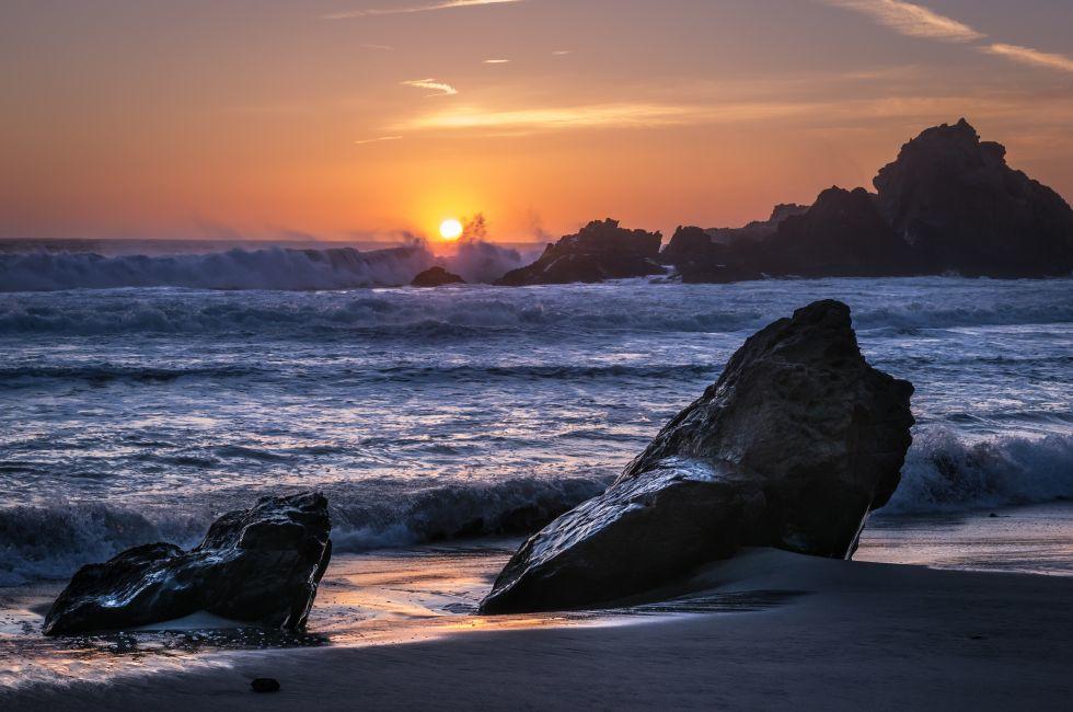 The sun sets over Pfeiffer Beach in Big Sur, California.