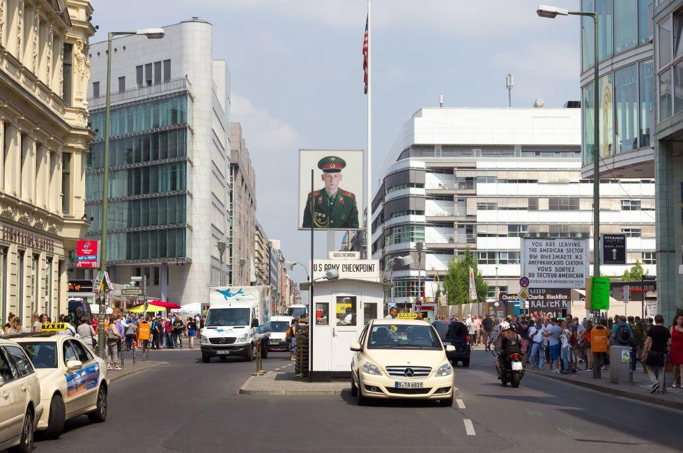 BERLIN, GERMANY - MAY 23: Tourists around the former Allied checkpoint 'Charlie' on May 23, 2014. Nowadays this site is a tourist attraction.