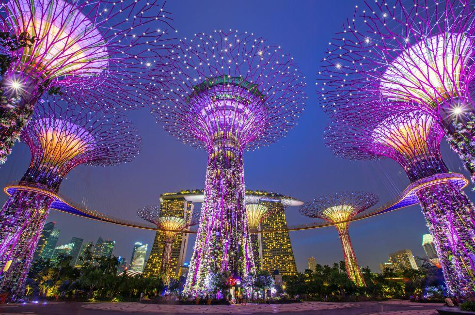 SINGAPORE -APRIL 6: Night view of Supertree Grove at Gardens by the Bay on April 6, 2013 in Singapore. Spanning 101 hectares of reclaimed land in central Singapore, adjacent to the Marina Reservoir; Shutterstock ID 143396617; Project/Title: Fodor's Go List