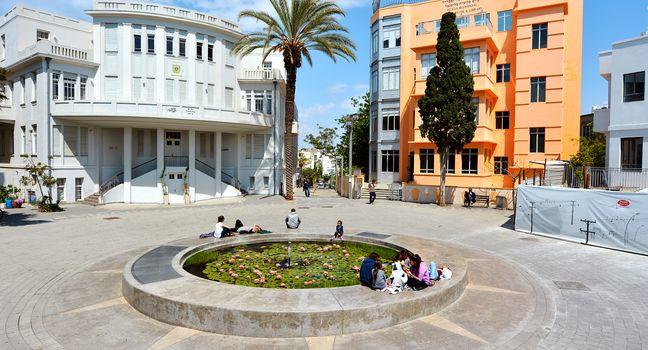 TEL AVIV - APR 10 2015:Visitors in Bialik Square in Tel Aviv, Israel. It was the home of the first city townhall with great example of Bauhaus architecture for which Tel Aviv was named the white city.