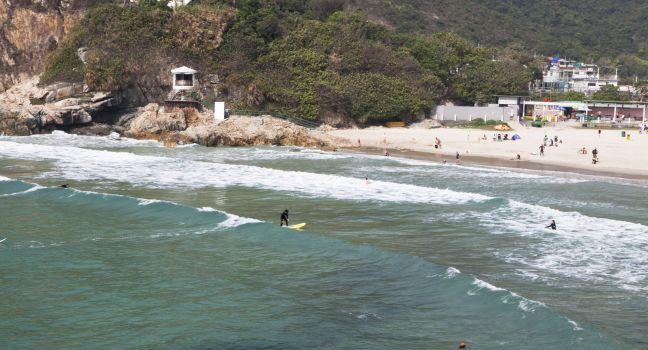 HONG KONG - APRIL 10: Tai Long Wan beach &quot;Big Wave Bay&quot; in Hong Kong on April 10 2011. Considered one of the most beautiful places in Hong Kong, it is a popular surf destination.;