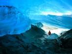 Explorer Inside Ice Cave, Mendenhall Glacier, Juneau, Alaska, USA;  