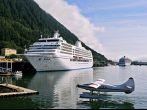 seaplane near docks for huge cruise ships in juneau alaska 