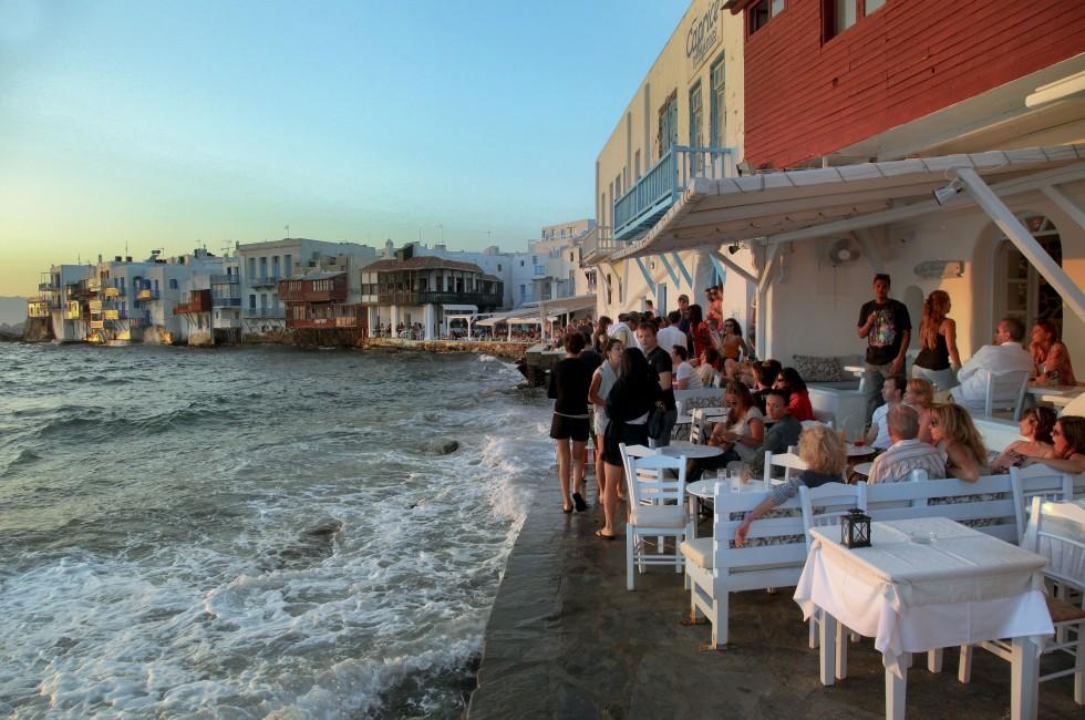 MYKONOS, GREECE - JUNE 29: Little Venice seaside on June 29, 2012 in Mykonos, Greece. Here the buildings have been constructed right on the sea's edge with their balconies overhanging the water. 