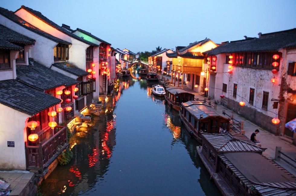 Suzhou, China; Suzhou, China - July 18, 2007: Suzhou old town in the evening - a canal, historic houses and chinese lanterns on July 18, 2007. Suzhou is a major tourist attraction in China.; 