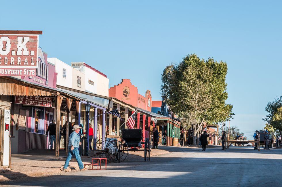 Looking down Allen Street in historic Tombstone, Arizona with cowboys and tourists.
