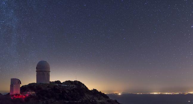 The Mayall observatory at Kitt Peak overlooks Tucson, Arizona on a clear starry night
