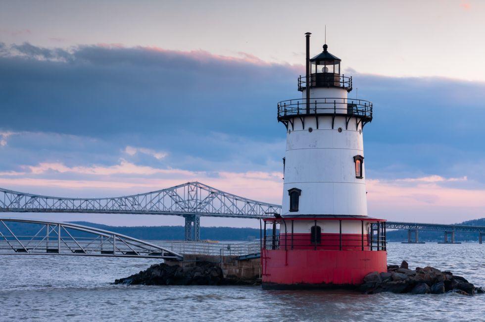 Dusk view of Tarrytown lighthouse with Tappan Zee bridge on the background; 
