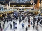 Liverpool street station in the UK at rush hour with all faces blurred out and logos/trademarks removed