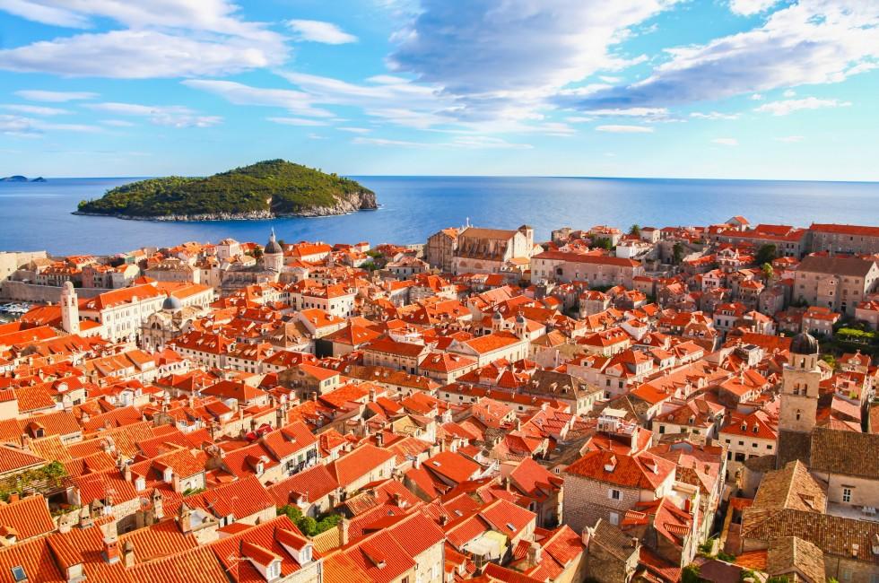 View of many landmarks of Old town in city of Dubrovnik, Croatia. Classic red tiled rooftops with Adriatic sea and island also are beautiful.