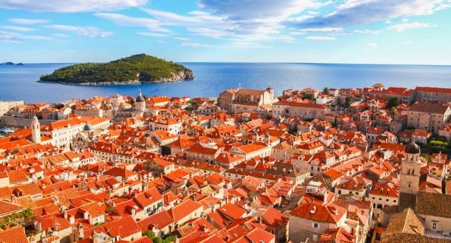 View of many landmarks of Old town in city of Dubrovnik, Croatia. Classic red tiled rooftops with Adriatic sea and island also are beautiful.