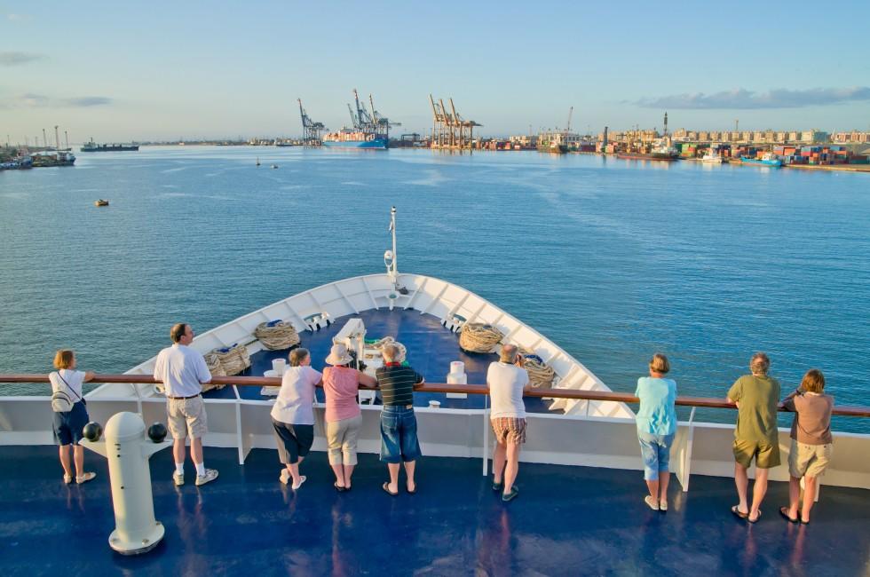SUEZ CANAL, EGYPT - NOV 17: Unidentified passengers view the Suez Canal at Port Said on November 17, 2010, near Suez. The canal was opened in 1869 to enable shipping directly between Europe and Asia.; Shutterstock ID 82941898; Project/Title: Silversea; Dow
