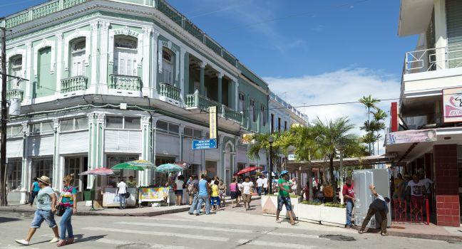 A lively downtown street in the city of Cienfuegos, Cuba.