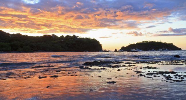 Sunset behind Punta Gorda on Playa Ocotal on the Pacific Ocean in Guanacaste, Costa Rica