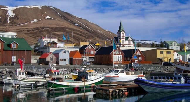 Icelandic Seaport: Boats for fishing and for whale watching tours gather at the port of Husavik, Iceland.; Shutterstock ID 126139541; Project/Title: Silversea; Downloader: Fodor's Travel