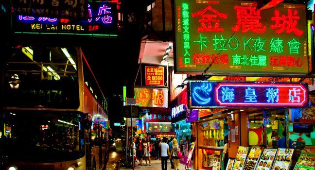 HONG KONG - AUGUST 01: signs, people and bus at night on Nathan Road in Kowloon, Hong Kong on August 02, 2012. Nathan Road is the main street in Kowloon and is lined with shops and restaurants; Shutterstock ID 114047152; Project/Title: Hong Kong city app; 