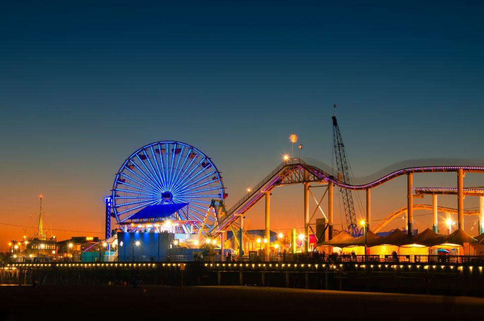 Ferris wheel on Santa Monica Pier lit up at dusk, Santa Monica, Los Angeles County, California, USA.