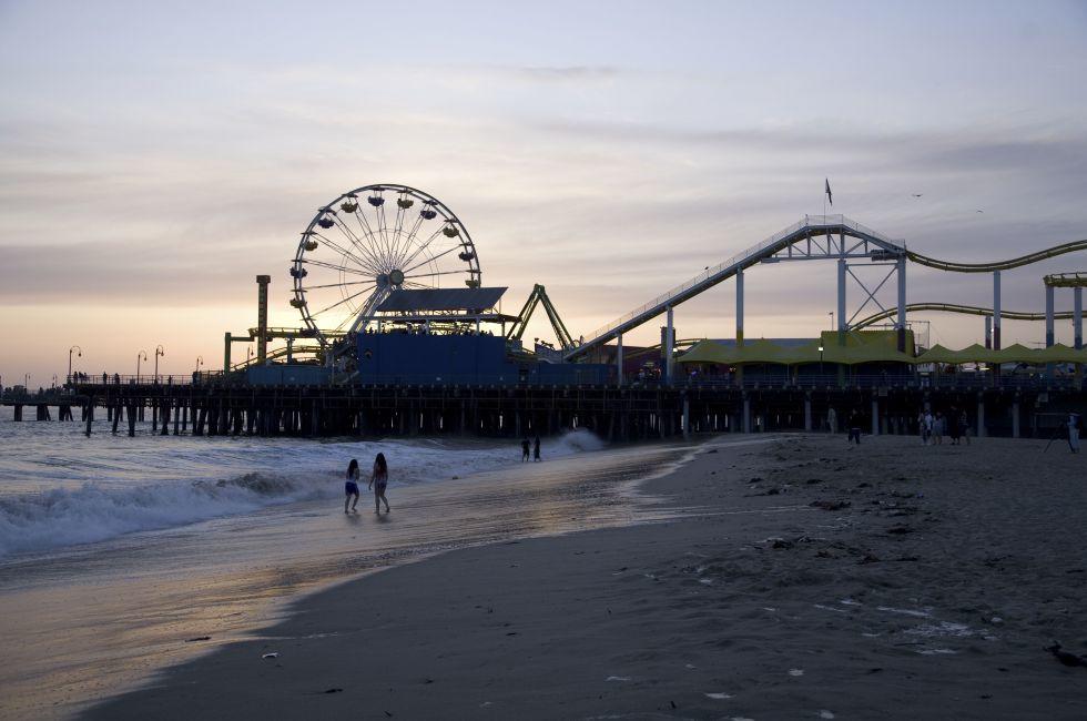 Santa Monica Beach, Santa Monica, CA May 3, 2008:  Horizontal image of the Santa Monica Pier with the prominent Ferris wheel and other thrill rides taken at dusk.; Shutterstock ID 12394999; Project/Title: Best Sunsets in America; Downloader: Melanie Marin
