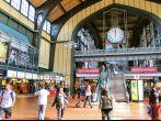 HAMBURG, GERMANY - AUGUST 28, 2014: Travelers walk inside the Central Railway Station (Hauptbahnhof) in Hamburg. With 450,000 daily passengers it is the 2nd busies station in Europe.