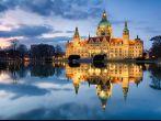City Hall of Hannover, Germany by night with cloudy sky and reflection in a lake. Photo taken on: April 06th, 2013 