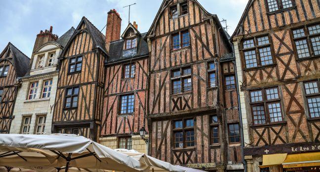 TOURS - JUNE 12: Half-timbered houses dating from the XV century on Plumereau Square, famous of bustling weekly markets and fairs in Tours, France on June 12, 2012; 