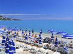 NICE, FRANCE - MAY 22: Sunbathers on the beach on May 22, 2013 in Nice. Nice has about 30 beaches which extend for more than 4 miles.; 
