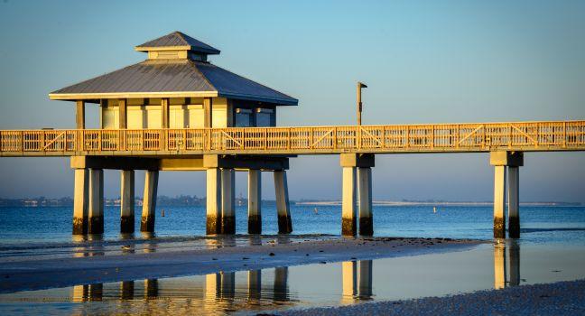 Pier in the Atlantic ocean at dusk, Fort Myers, Lee County, Florida, USA; 