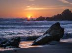 The sun sets over Pfeiffer Beach in Big Sur, California.