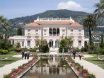 Saint-Jean-Cap-Ferrat, France – May 27, 2013: People visiting of Villa Ephrussi de Rothschild is a located at Saint-Jean-Cap-Ferrat on the French Riviera. The villa constructed between 1905 and 1912 by Baroness Béatrice de Rothschild, a member 
