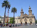 SANTIAGO - FEBRUARY 1, 2012: Summer brings tourists to downtown Santiago. Visitors gather in front of the Santiago Cathedral at Plaza de Armas in the city historic center on February 1, 2013.