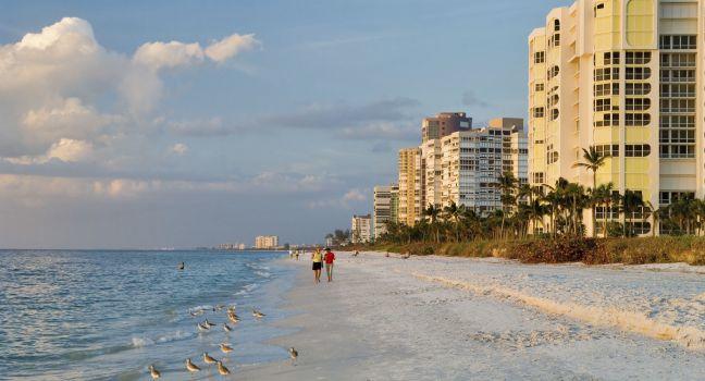 florida gulf coast beach at naples in late afternoon; 
