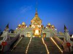 Wat Traimit entrance at dusk in Bangkok, Thailand.  Traimit temple, located near China town, is built in 1832 by three Chinese donors.; 