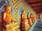 BANGKOK, THAILAND - AUGUST 11: golden Buddha statues in Wat Arun temple, Bangkok - Thailand on August 11,2012. Buddhism is Thailand official religion and is the religion of more than 90% of its people; Shutterstock ID 131225321; Project/Title: Bangkok App;