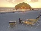 Beach chairs and umbrellas at sunset, Clearwater, Florida.;