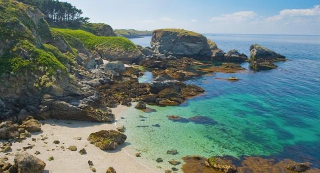 The image of a wild beach with emerald water in the coast of island Belle Ile en Mer. France; 