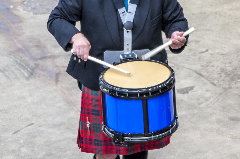 INVERNESS, SCOTLAND,UK - SEPTEMBER 2012; Scottish musician drummer from a band acts as host upon arrival of transatlantic ships in the port of Invergordon in Scotland. Taken september 2, 2012.
