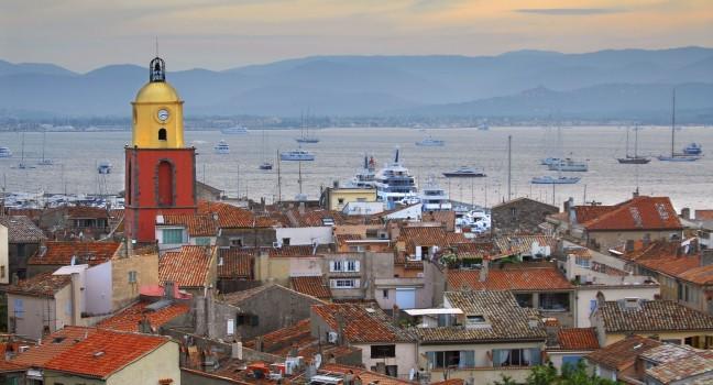 View at St.Tropez and anchored ships at sunset in French Riviera. 