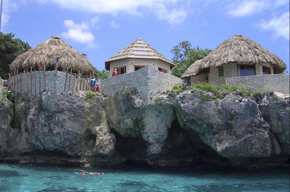 TURQUOISE OCEAN. Building houses on Negril Coast.; 