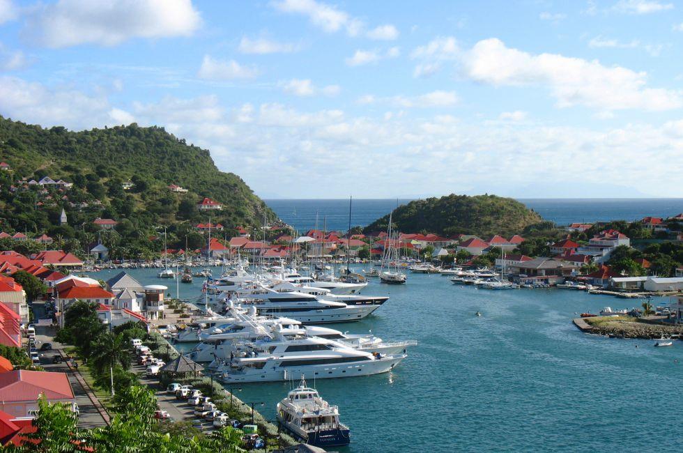 ST BARTS, FRENCH WEST INDIES - JANUARY 16:Aerial view at Gustavia Harbor with mega yachts on January 16, 2006 at St Barts. The island is popular tourist destination during the winter holiday season 