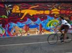 Bicycle rider, East Side Gallery, Berlin, Germany 
