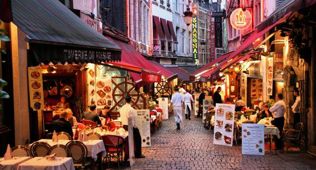 BRUSSELS - SEPTEMBER 1: Evening view of restaurants on September 1, 2009 in Brussels, Belgium. Rue des Bouchers street is famous for numerous restaurants offering cuisine from any place in the world.