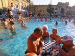 At the Szechenyi Medicinal Bath, Europe's largest, soaking onlookers analyze the latest chess moves amongst a neo-baroque palace in a city with the world's most thermal springs, Budapest, Hungary
