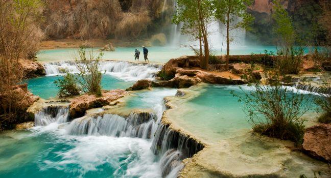 Hiking at beautiful Havasu Falls in Arizona. 