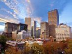 Sunset on an Autumn Day Over the Downtown Denver Skyline with Trees Changing for Autumn and Dramatic Clouds