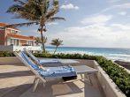 CANCUN, MEXICO - MARCH 18: Two Sunbathing Chairs toward the Ocean in a beach resort on March 18, 2011 in Cancun. There are about 140 hotels in Cancun with more than 24,000 rooms and 380 restaurants.