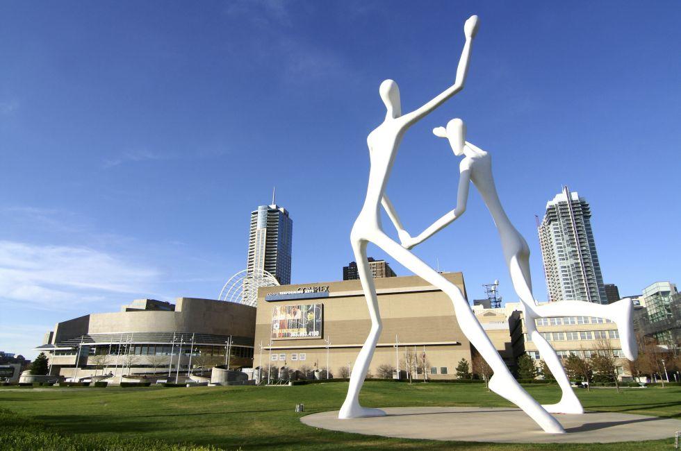 Sculpture Park is home to the landmark sculpture by Jonathan Borofsky: Dancers. The towering figures are a familiar landmark in downtown Denver, Colorado and the park provides a beautiful entrance to the Denver Performing Arts Center.