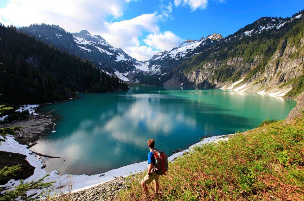 Hiker on the Blanca Lake, Washington. State. Located in the Henry M. Jackson Wilderness Area, Beautiful turquoise green lake. Only accessible by foot. Elevation Gain: 2700 ft in. 5 hours, 8 miles.; Shutterstock ID 75001846; Project/Title: Weekend Getaways;