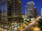Long exposure photo of the a city street in downtown Phoenix, Arizona at night. 