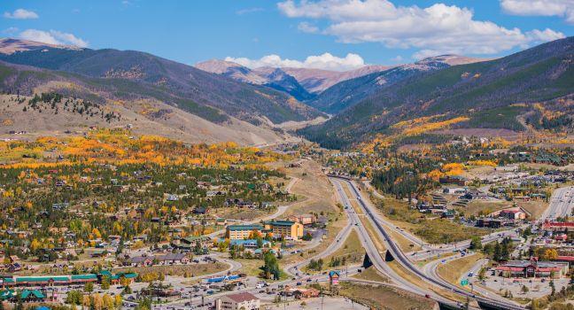 Silverthorne and Dillon Cities in Colorado. Cities Panorama with I-70 Interstate Highway in the Middle. Early Fall Time.